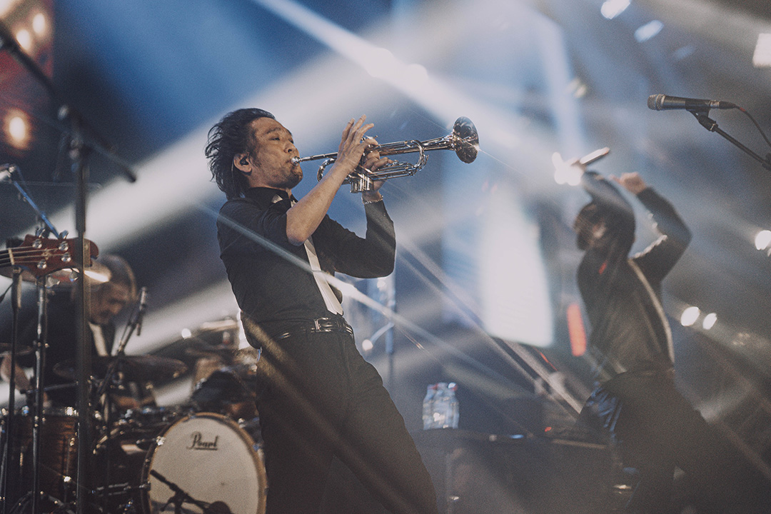 Masayoshi Soken playing the trumpet on stage at Fan Festival 2026 in Berlin.