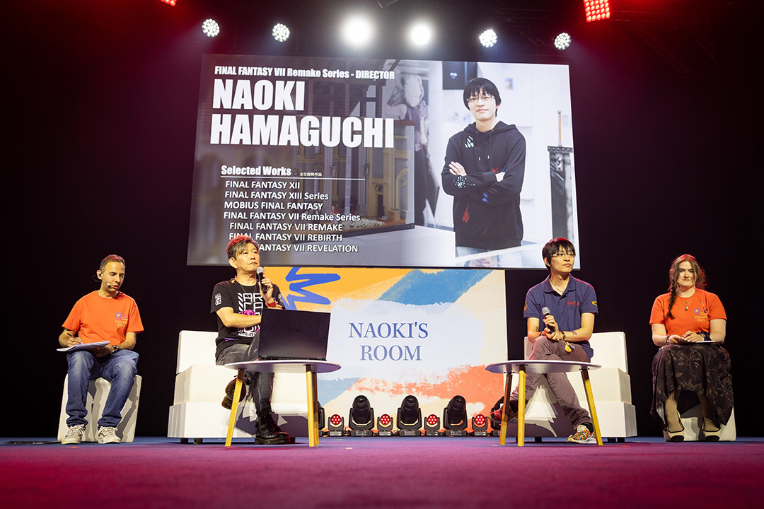 Naoki Yoshida, Naoki Hamaguchi, alongside two interpreters dressed in orange on stage for the Naoki's Room stage show at Fan Festival 2026 in Berlin.